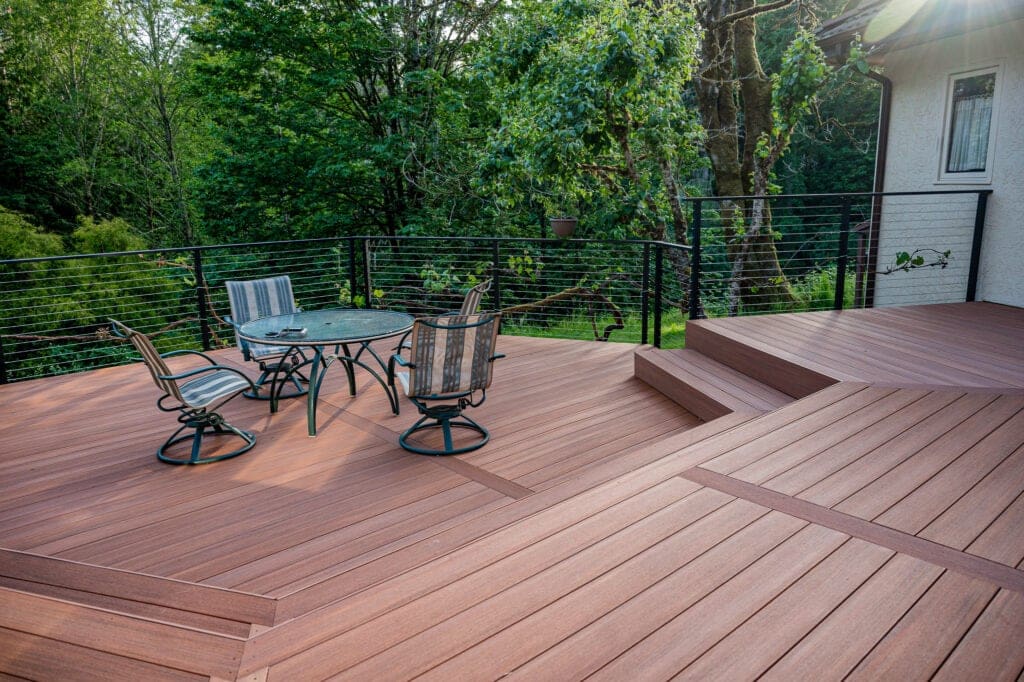 Brown composite decking with matte black fascia mounted cable railing
