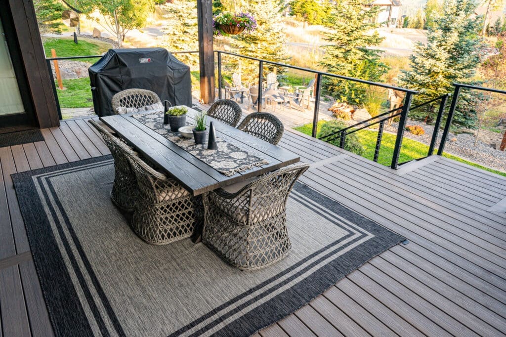 Outdoor wooden dinner table on deck