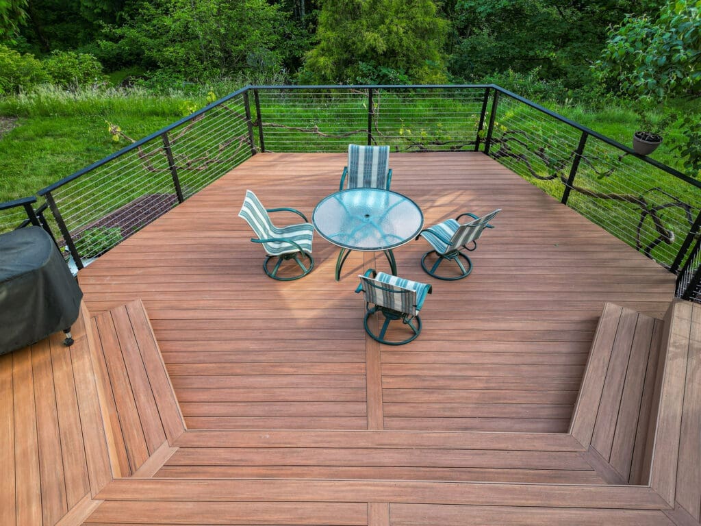 Brown composite decking with matte black fascia mounted cable railing