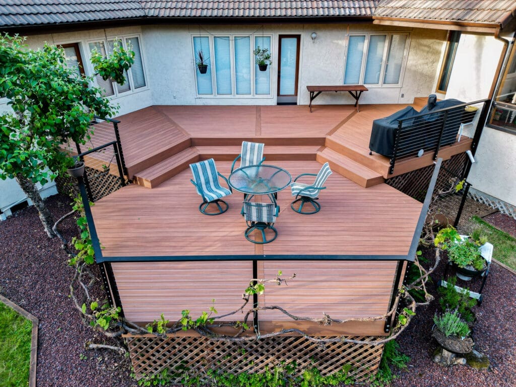 Brown composite decking with matte black fascia mounted cable railing