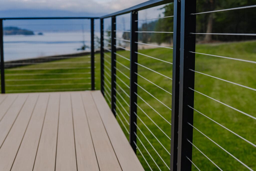 Modern cable railing with scenic lake view for deck
