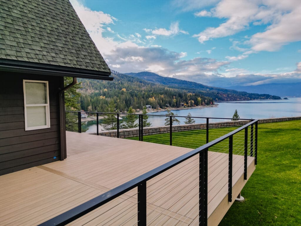 House deck overlooking picturesque lake and mountains