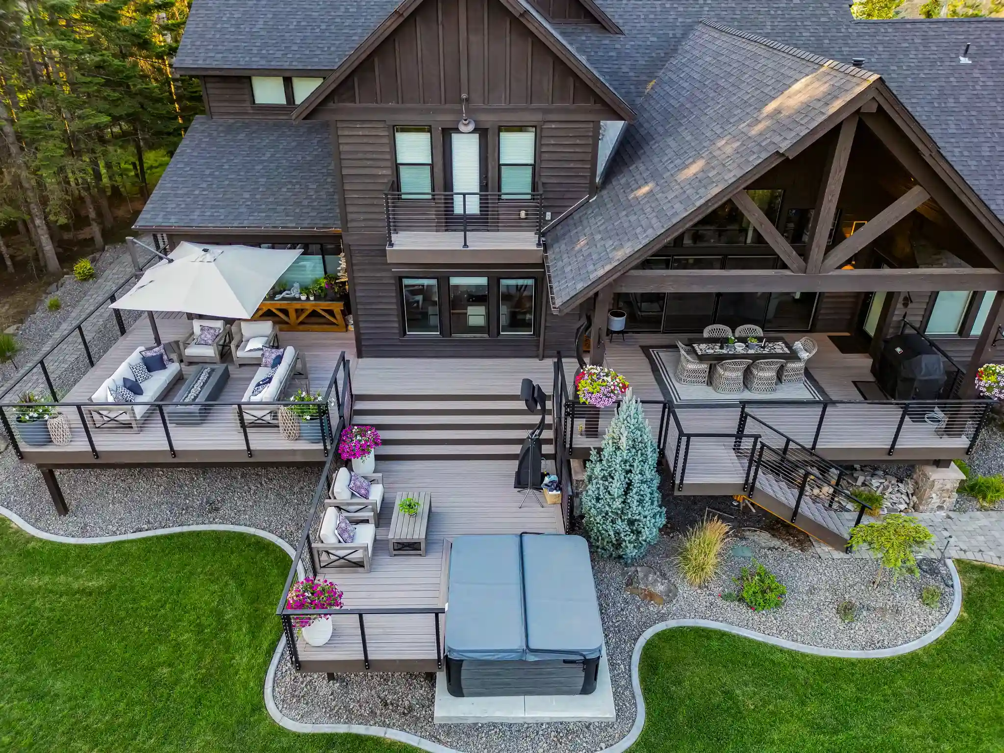 Modern wooden deck with outdoor seating and hot tub.