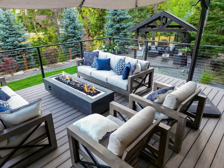 Modern patio with fire pit and seating area.