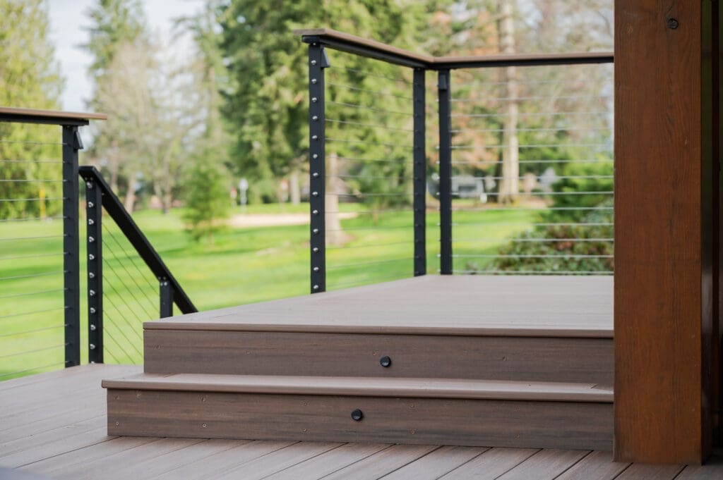 Wooden deck with metal railing in garden