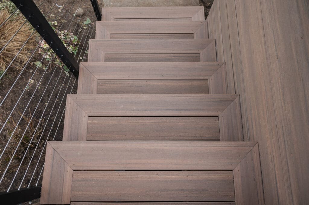 Wooden outdoor staircase with metal railing