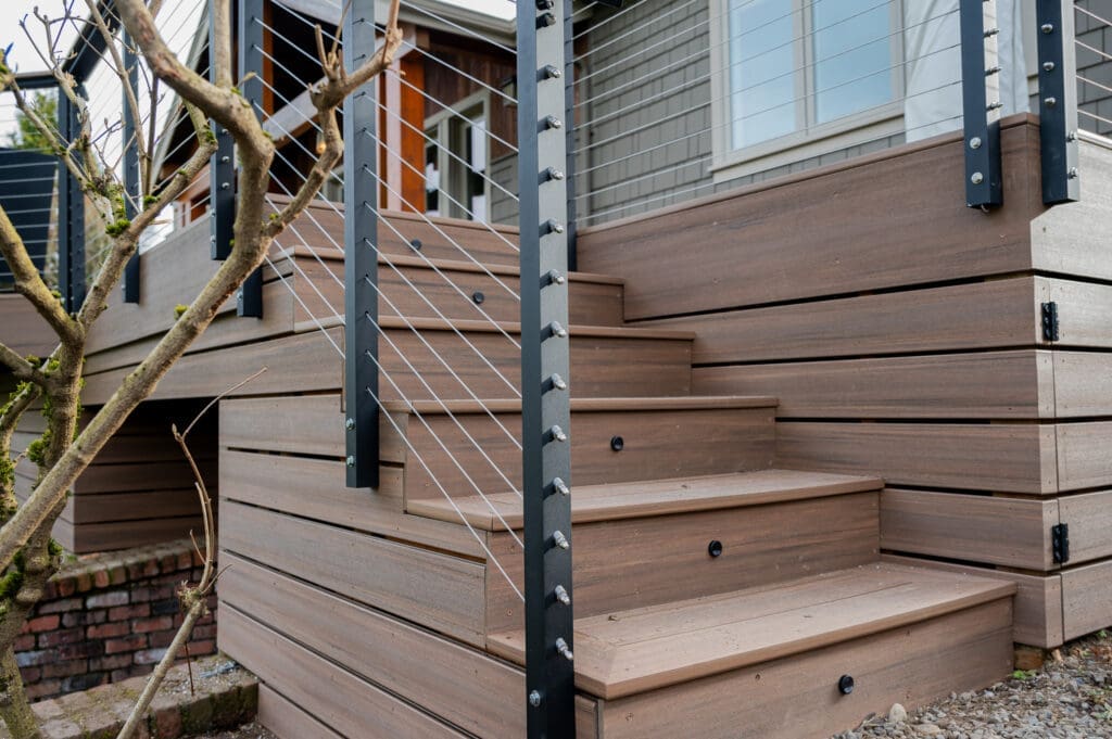 Deck stairs with cable railing system