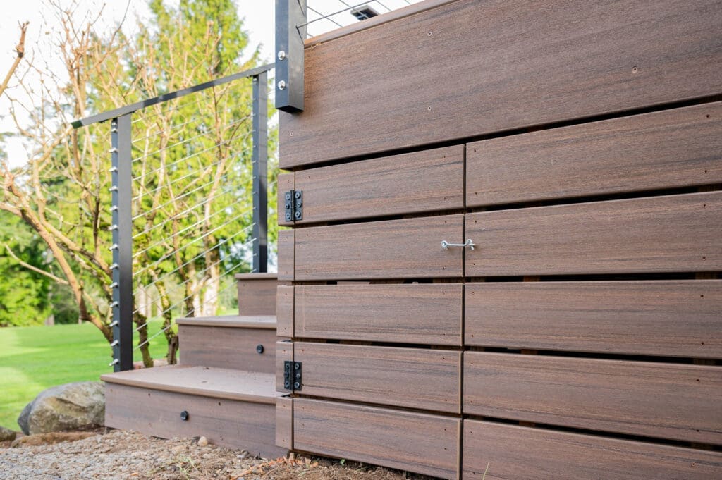 Wooden deck with stairs and metal railing