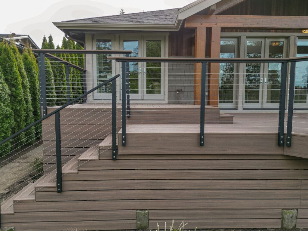 Modern deck with cable railing and wooden steps