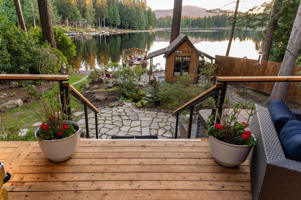 Scenic lake view from a cozy wooden deck.