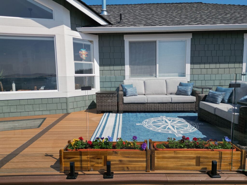 Outdoor patio with seating and colorful flowers