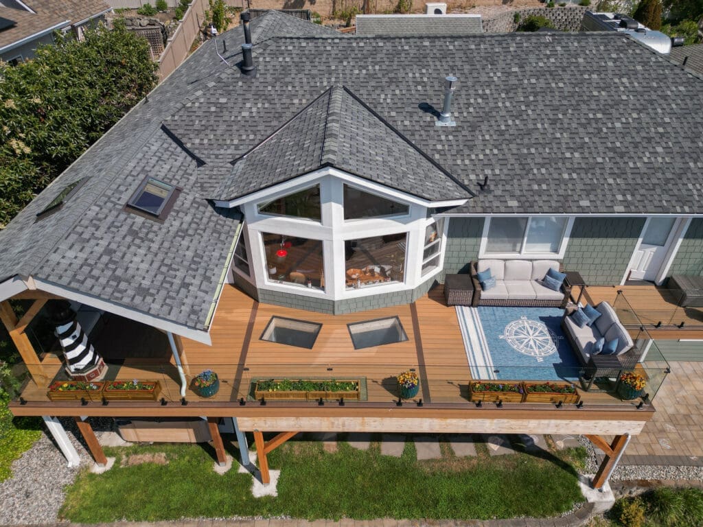 Aerial view of modern house with spacious deck.