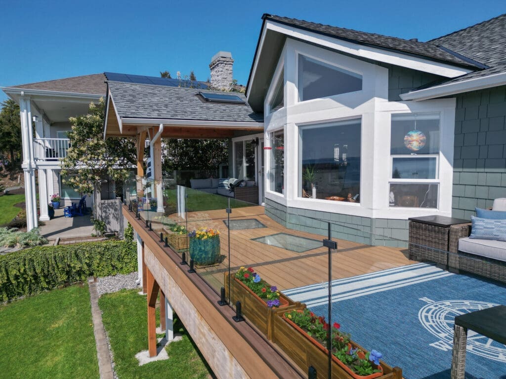 Modern house with spacious wooden deck and garden.