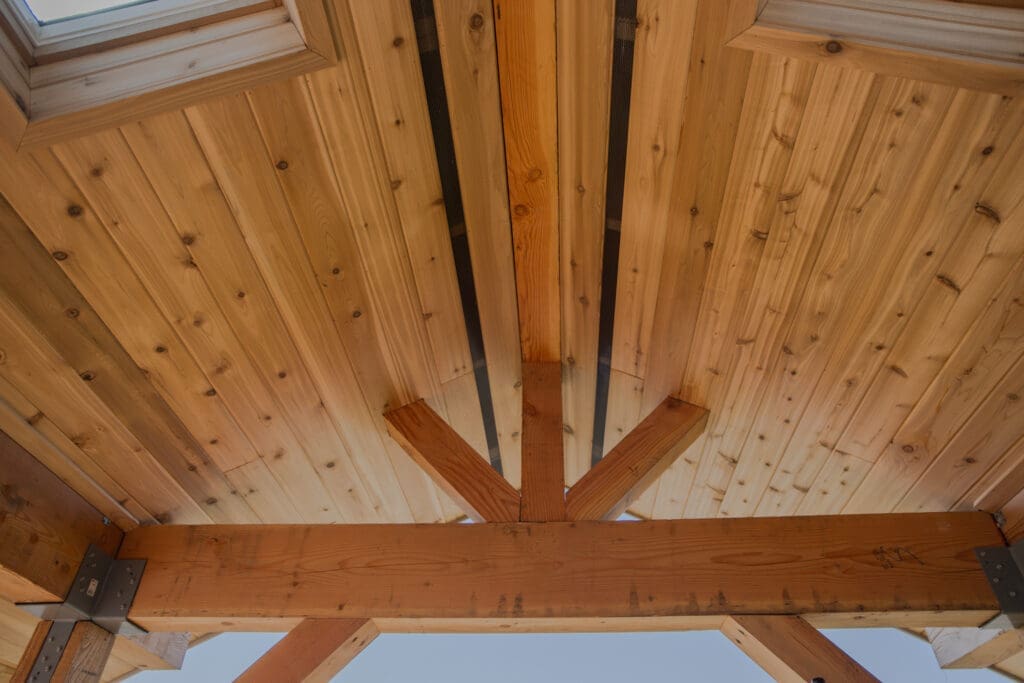 Wooden ceiling and beams with metal brackets