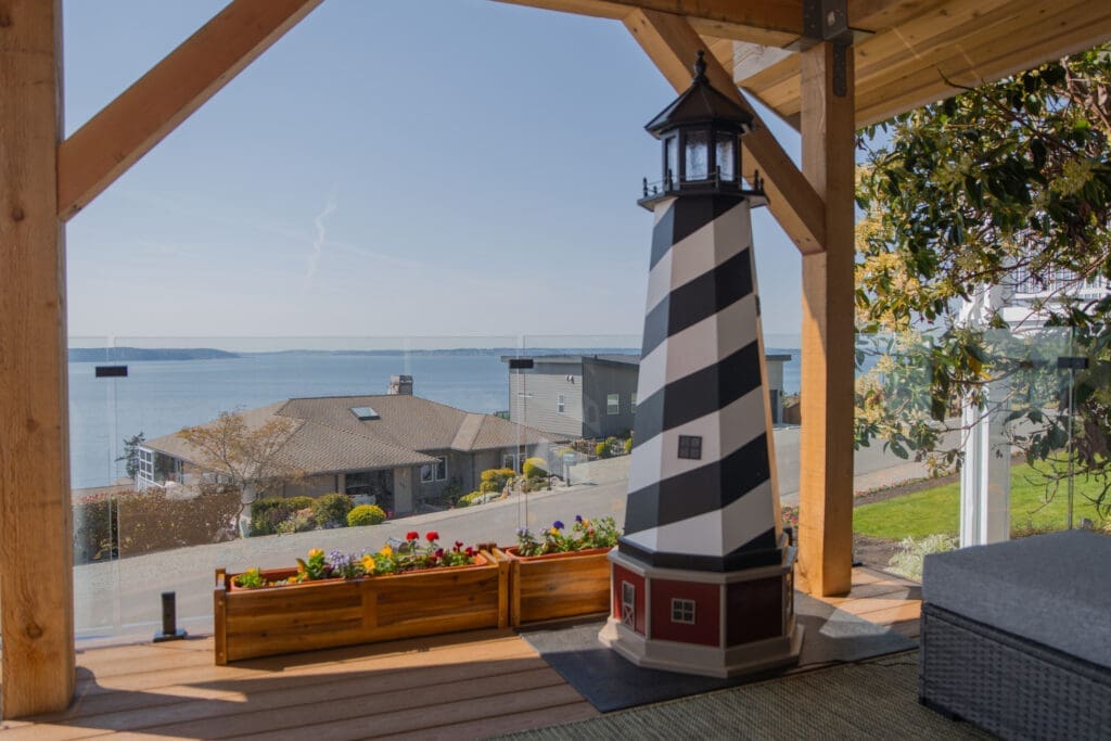 Mini lighthouse with ocean view from deck.