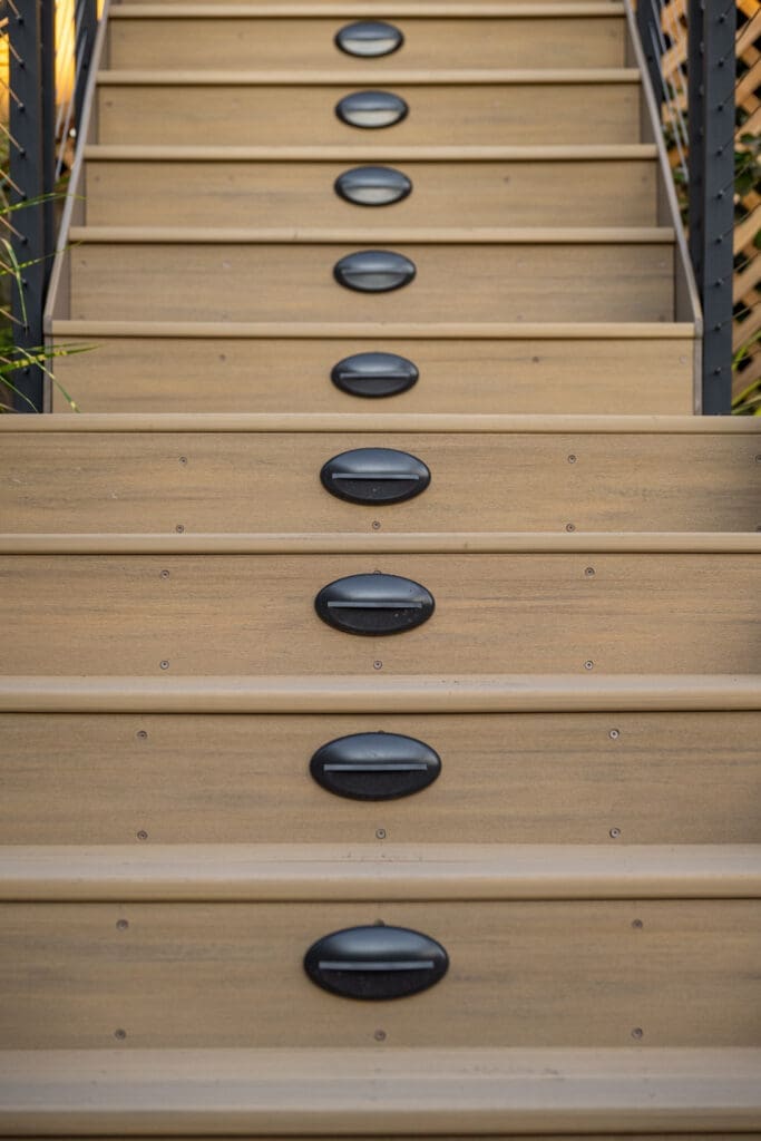 composite steps with black stair lights on each step.