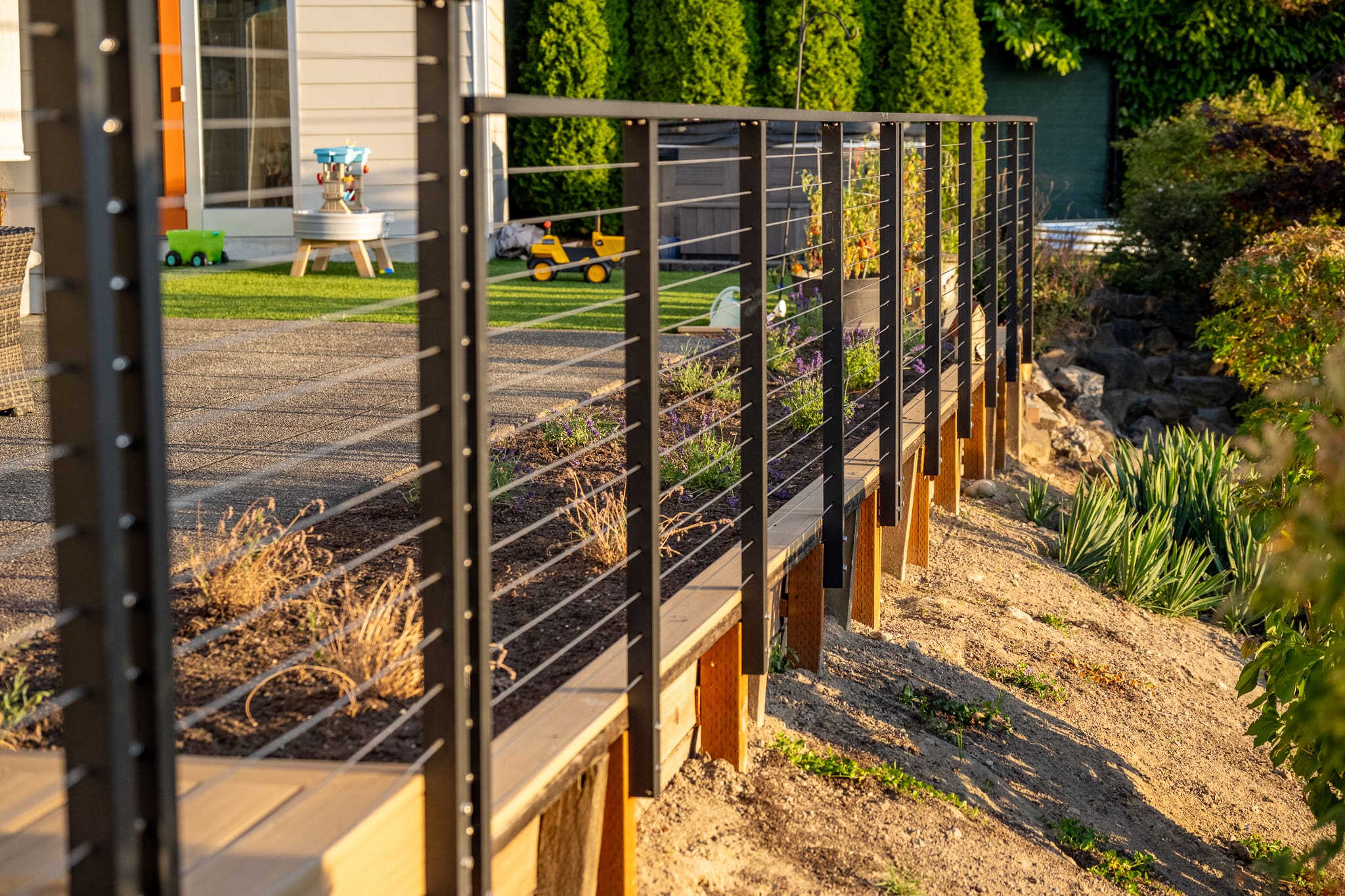 Backyard garden with cable railing
