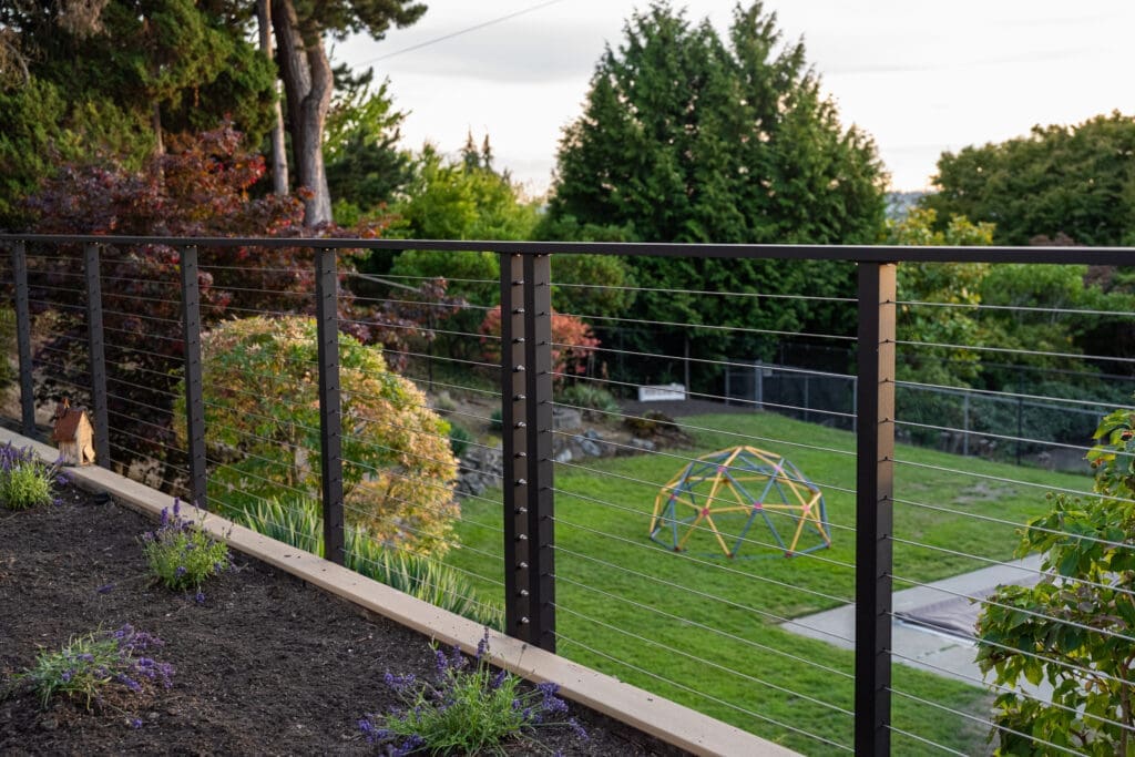 Backyard view with cable railing and climbing dome