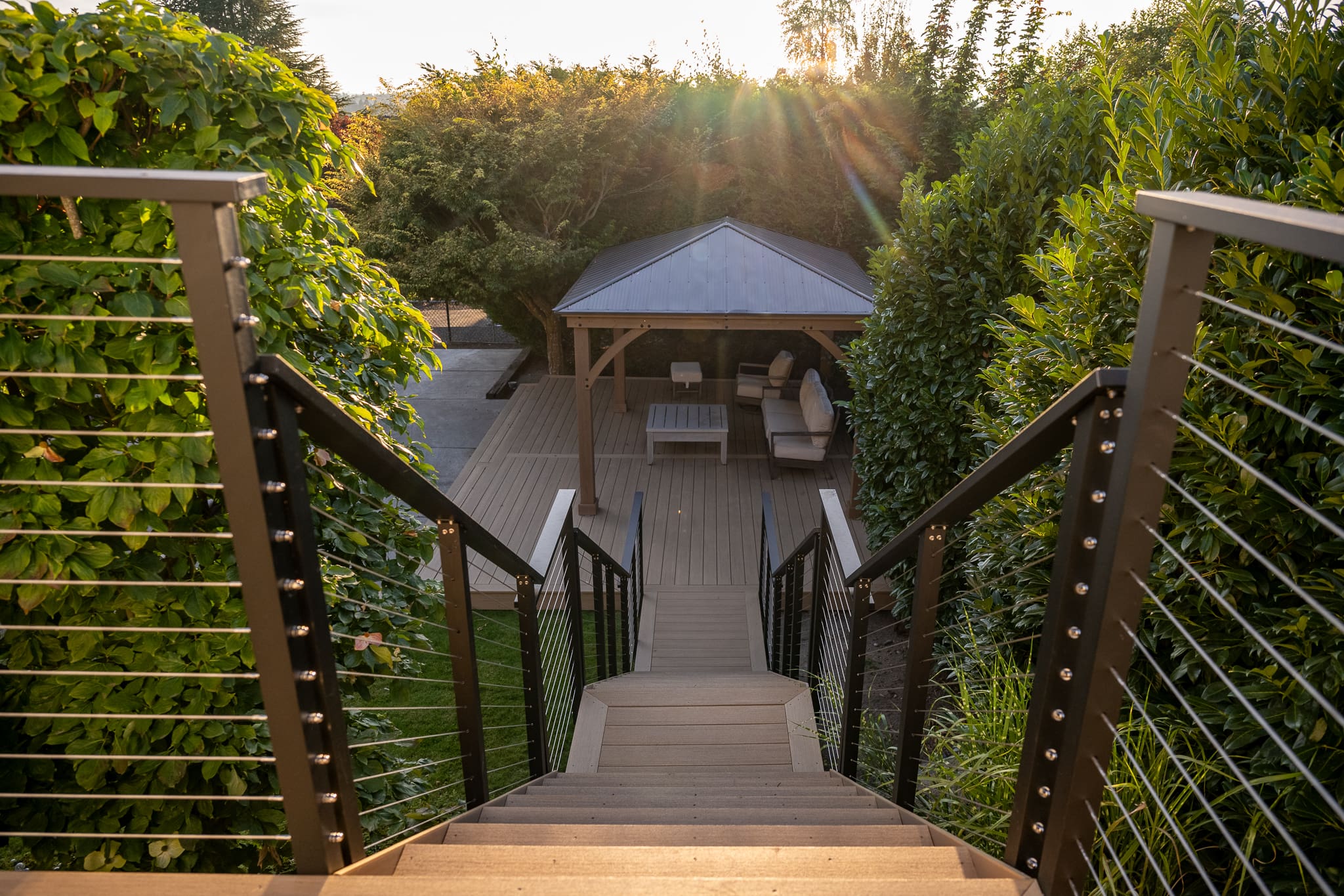 composite deck with gazebo and garden view.