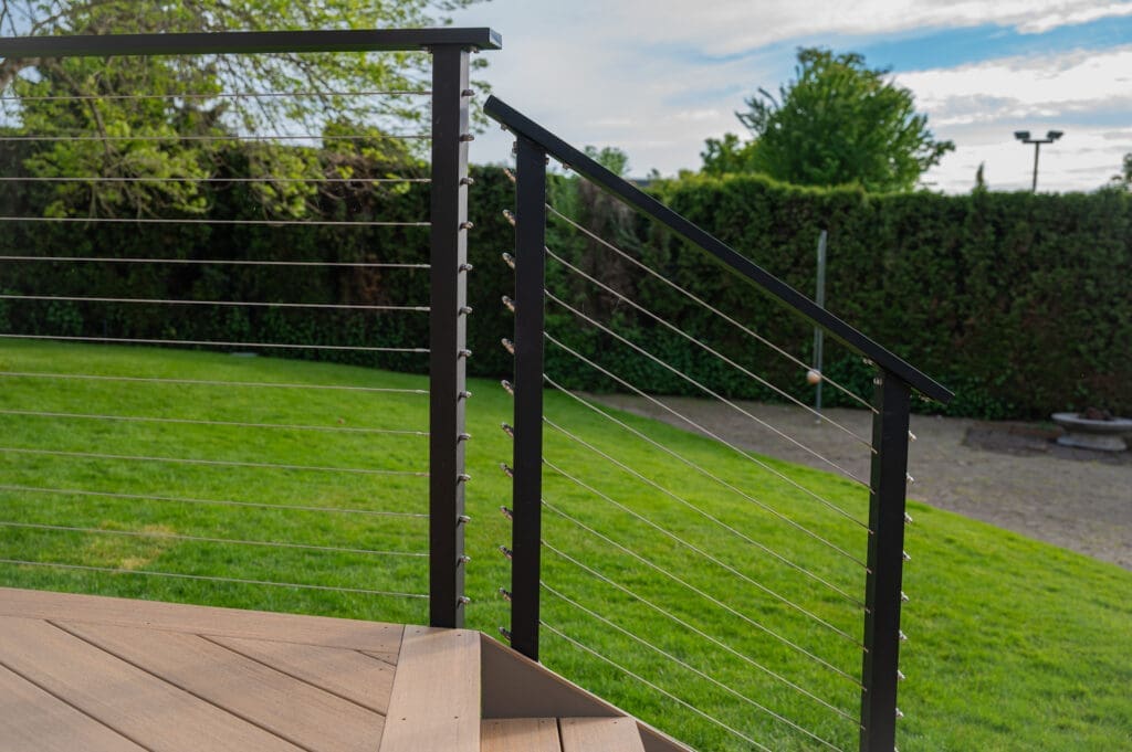 Modern cable railing on backyard deck
