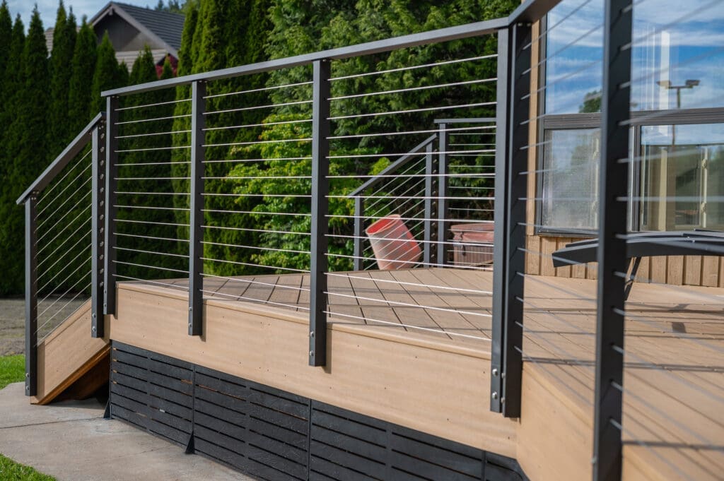 Modern wood deck with black cable railing