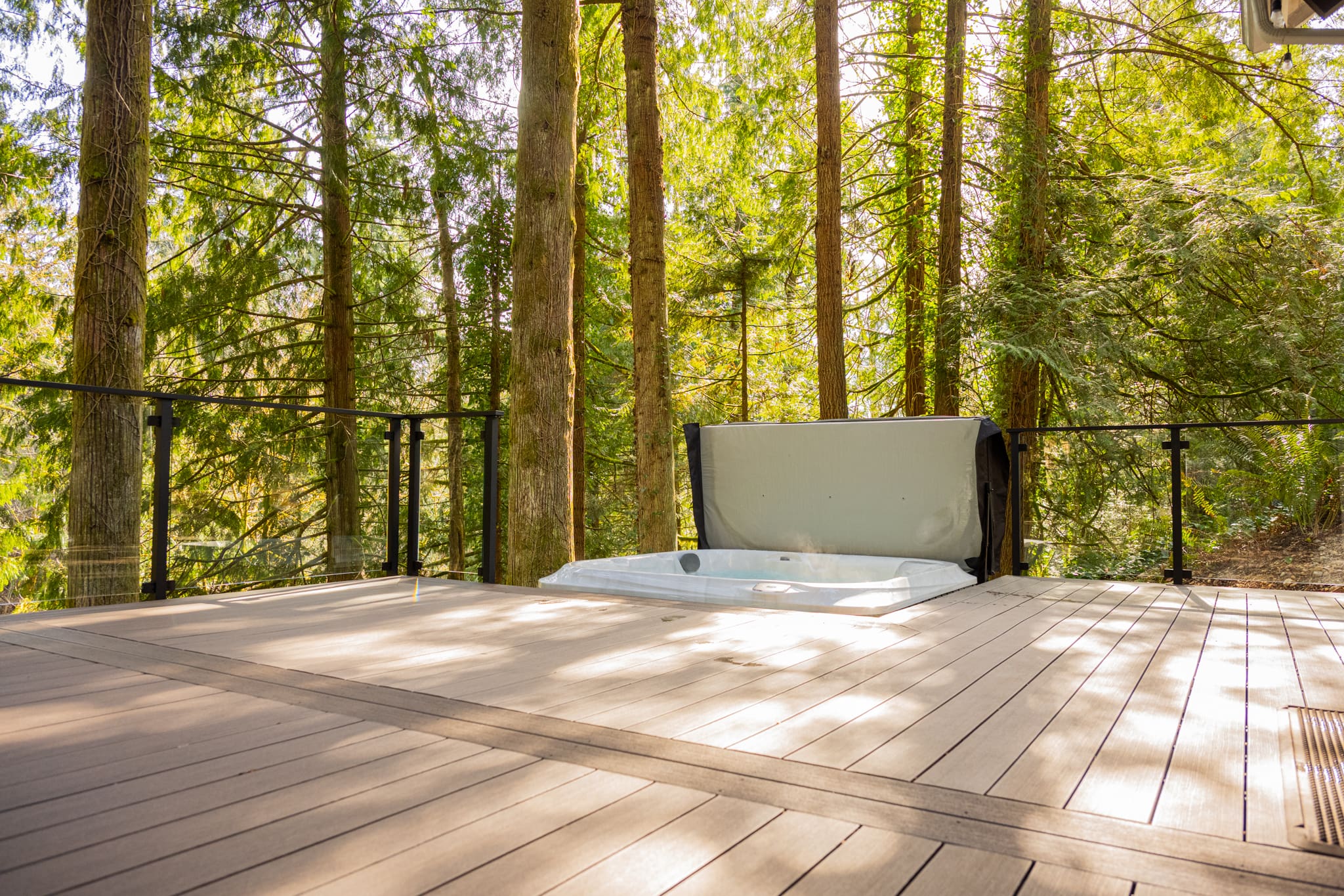 Forest deck with built-in outdoor hot tub