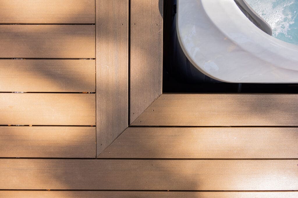 Wooden deck corner beside outdoor hot tub