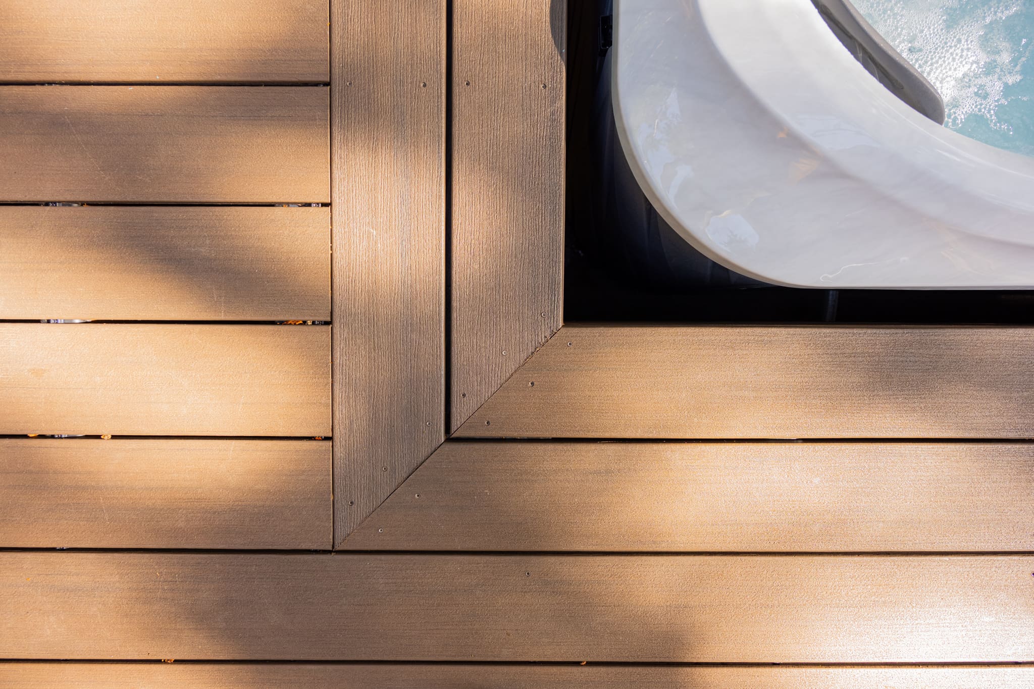 Wooden deck corner beside outdoor hot tub