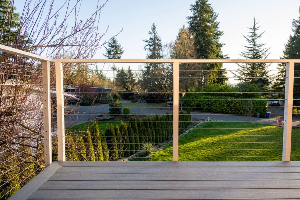Wooden deck overlooking green suburban backyard