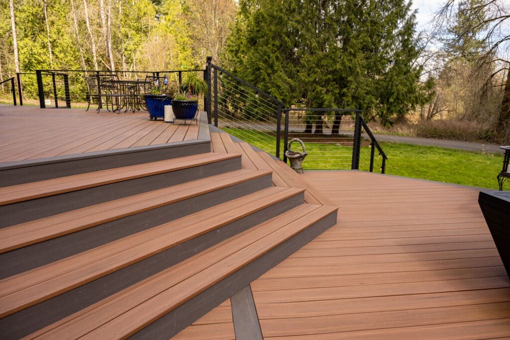 Modern wooden deck with steps and cable railing