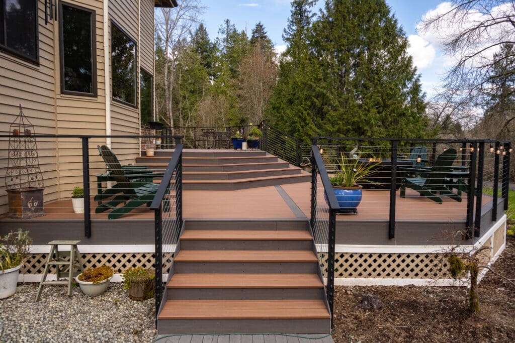 Modern backyard deck with stairs and seating