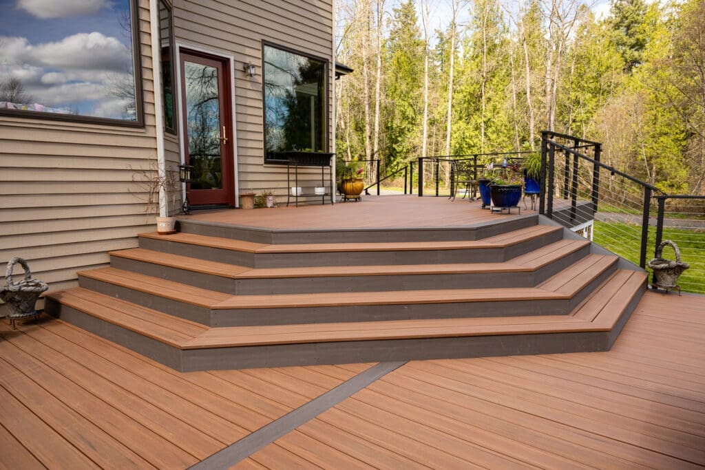 Multi-level backyard deck with wide steps and railing