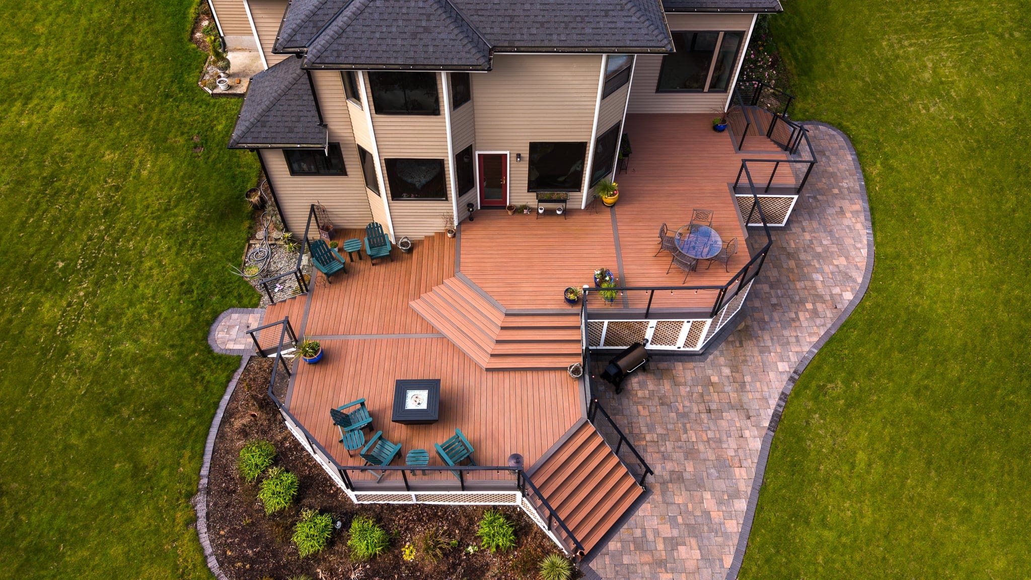 Aerial view of multi-level wooden backyard deck