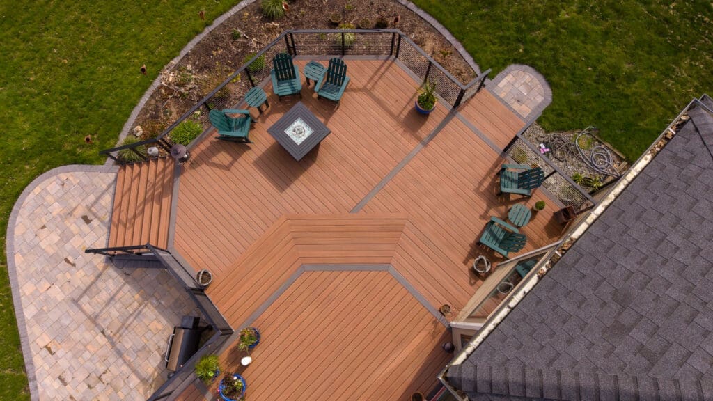 Aerial view of wooden backyard deck with seating