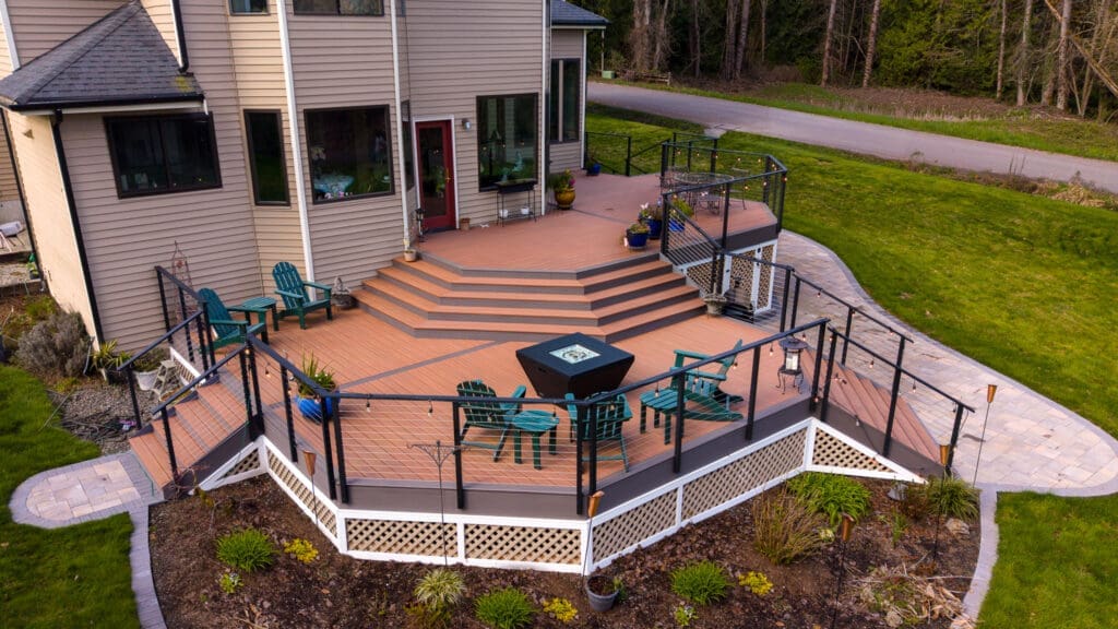 Multi-level backyard deck with seating and fire pit