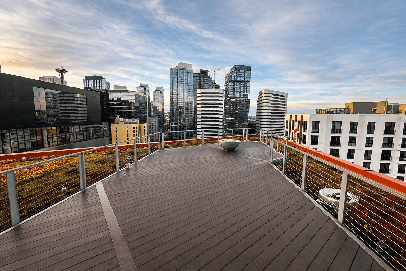Rooftop deck overlooking Seattle skyline at sunset