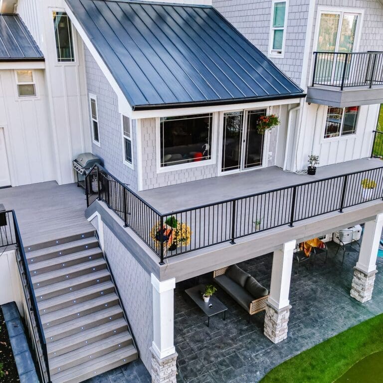 Elevated backyard deck with stairs and covered patio