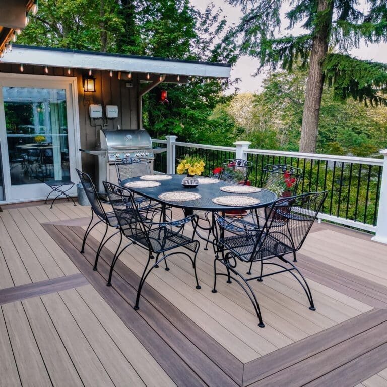 Outdoor deck with dining set and grill