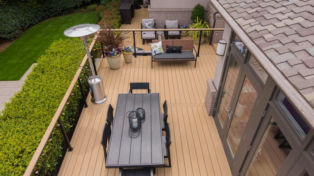 Modern backyard deck with dining table and seating