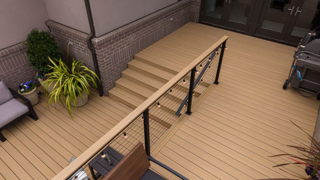 Modern composite deck with stairs and metal railing