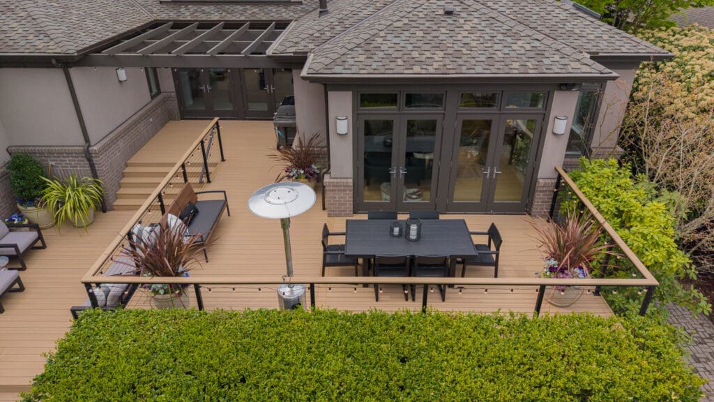 Modern backyard deck with dining area and railing