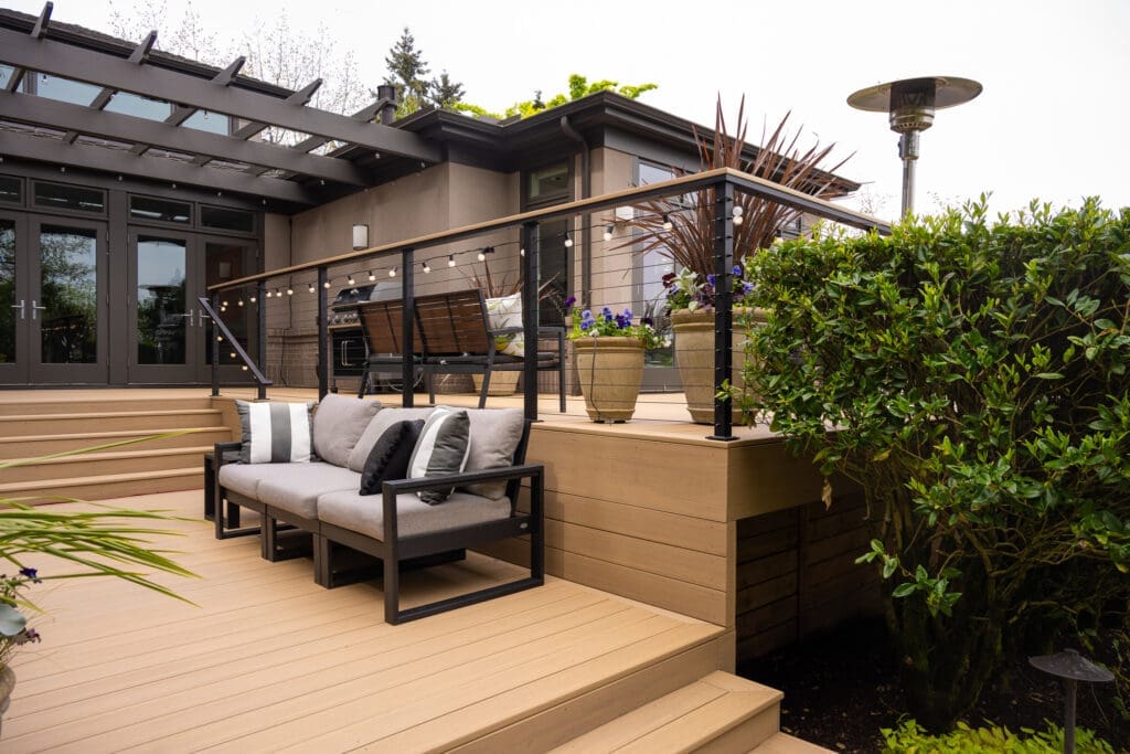 Modern backyard deck with seating and pergola