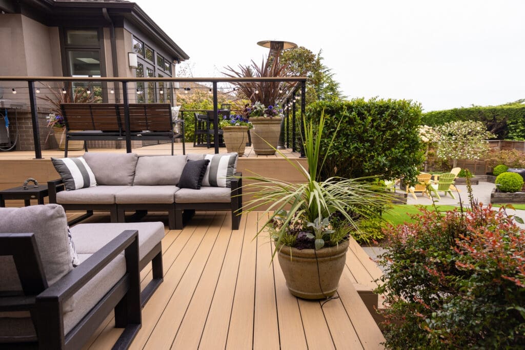 Modern backyard deck with outdoor seating and plants