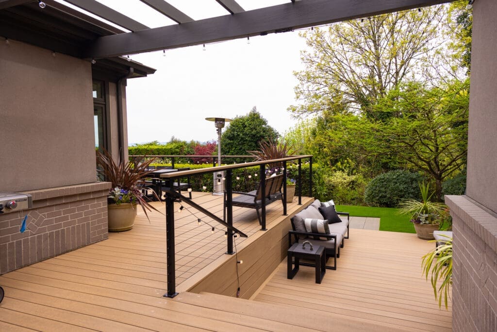 Modern backyard deck with pergola and seating area