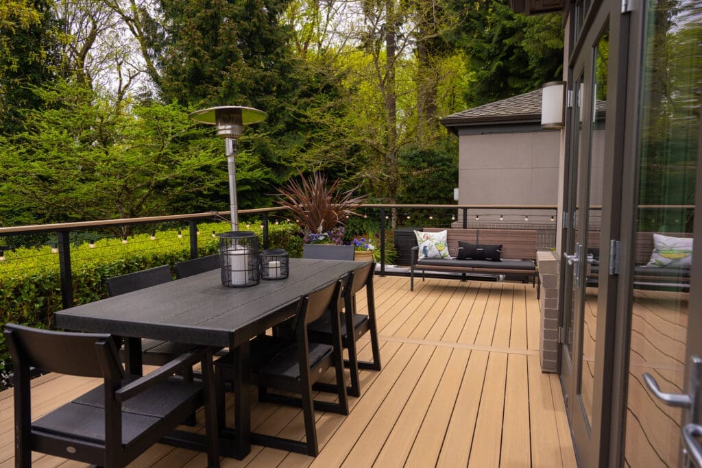 Modern outdoor deck with dining table and seating