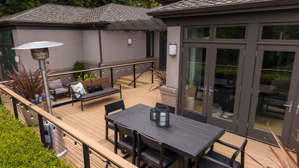 Modern backyard deck with dining table and seating
