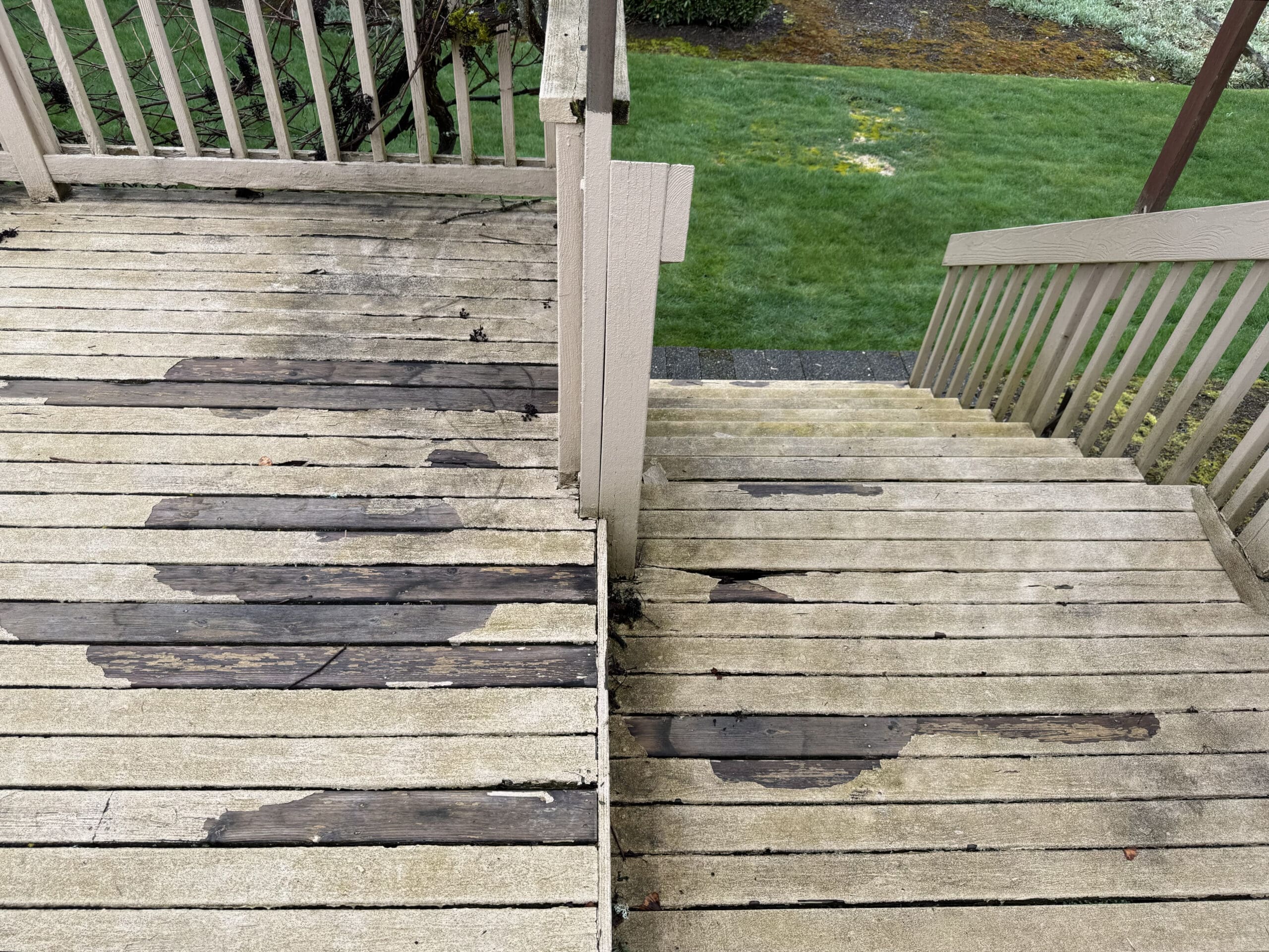 Worn wooden deck and stairs with peeling paint
